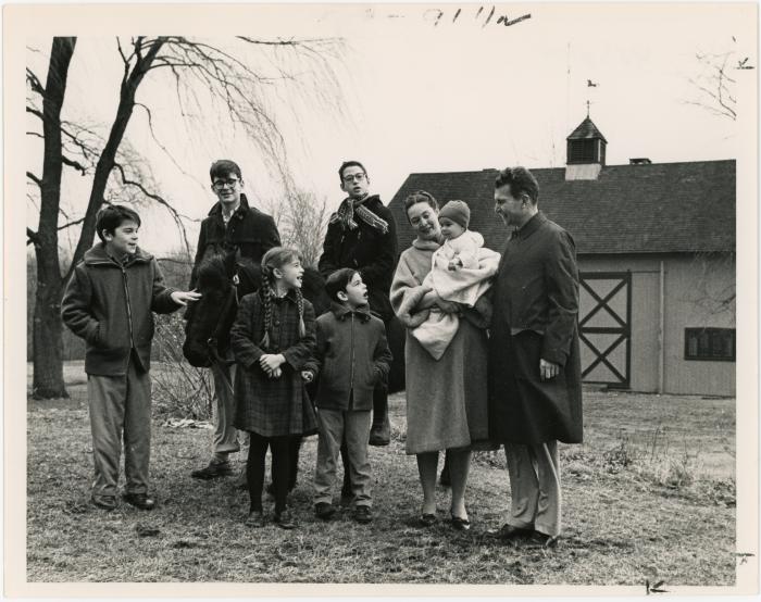 Dave Brubeck, Iola Brubeck, Cathy Brubeck, Michael Brubeck, Dan Brubeck, Darius Brubeck, Chris Brubeck, and Matt Brubeck in front of a barn (Wilton, Connecticut [?])