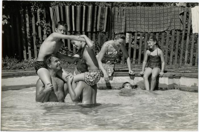 Dave Brubeck, Iola Brubeck, Cathy Brubeck, Dan Brubeck, Darius Brubeck, Michael Brubeck, and Chris Brubeck in a pool at Irving Townsend house (Wilton, Connecticut)