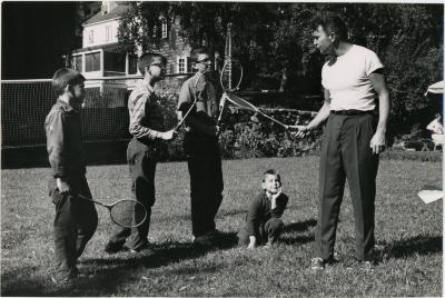 Dave Brubeck giving badminton lesson to Darius Brubeck, Michael Brubeck, Chris Brubeck, Dan Brubeck at Irving Townsend house (Wilton, Connecticut)