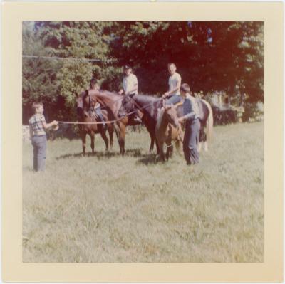 Michael Brubeck and siblings on horseback and leading ponies (Wilton, Connecticut)