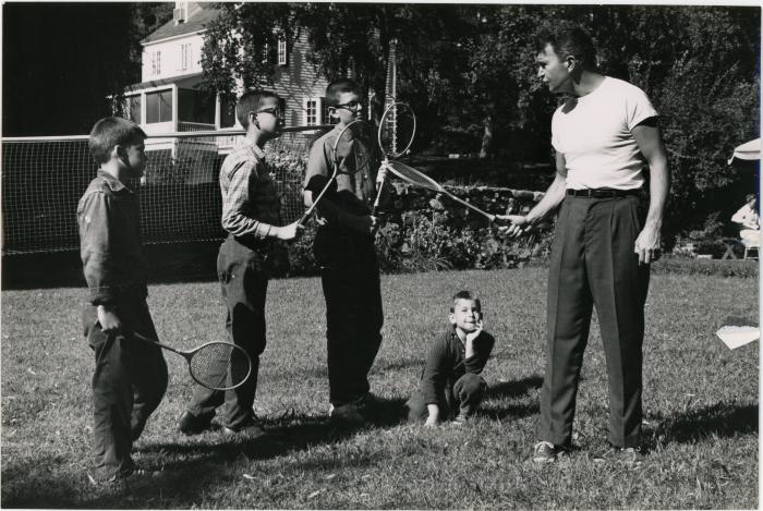 Dave Brubeck giving badminton lesson to Darius Brubeck, Michael Brubeck, Chris Brubeck, Dan Brubeck at Irving Townsend house (Wilton, Connecticut)