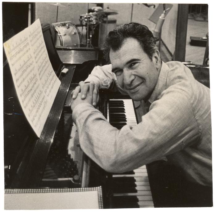 Dave Brubeck at piano, leaning across keyboard